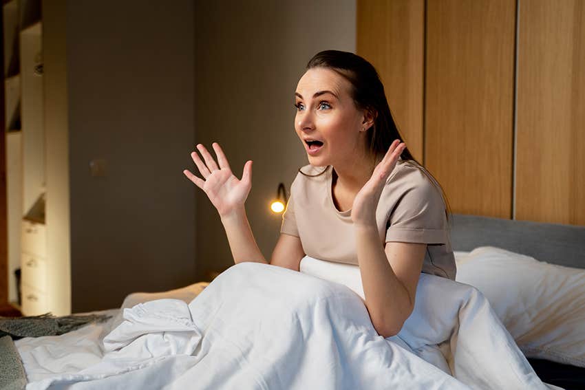 woman experiences a hypnic jerk when falling asleep