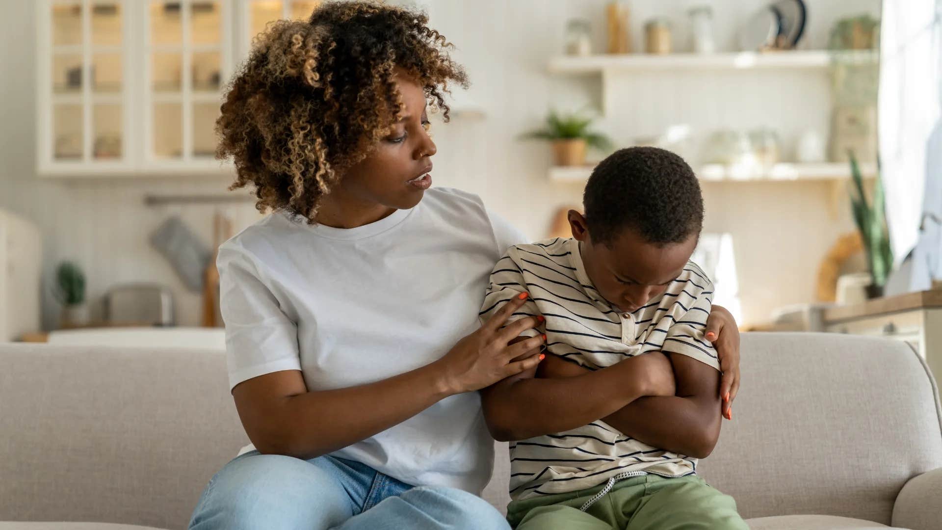 mom comforting son telling him you can be whatever you want to be