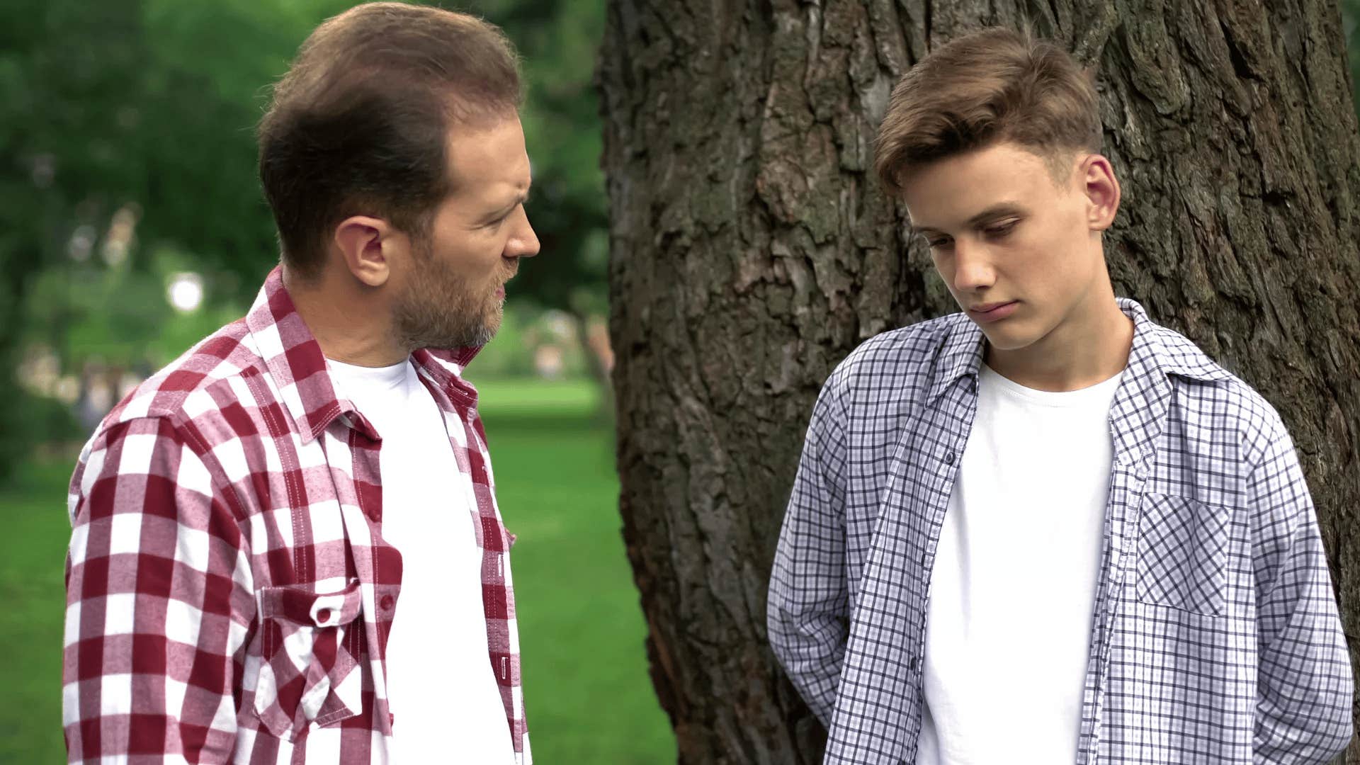 man having a serious conversation with his teenage son