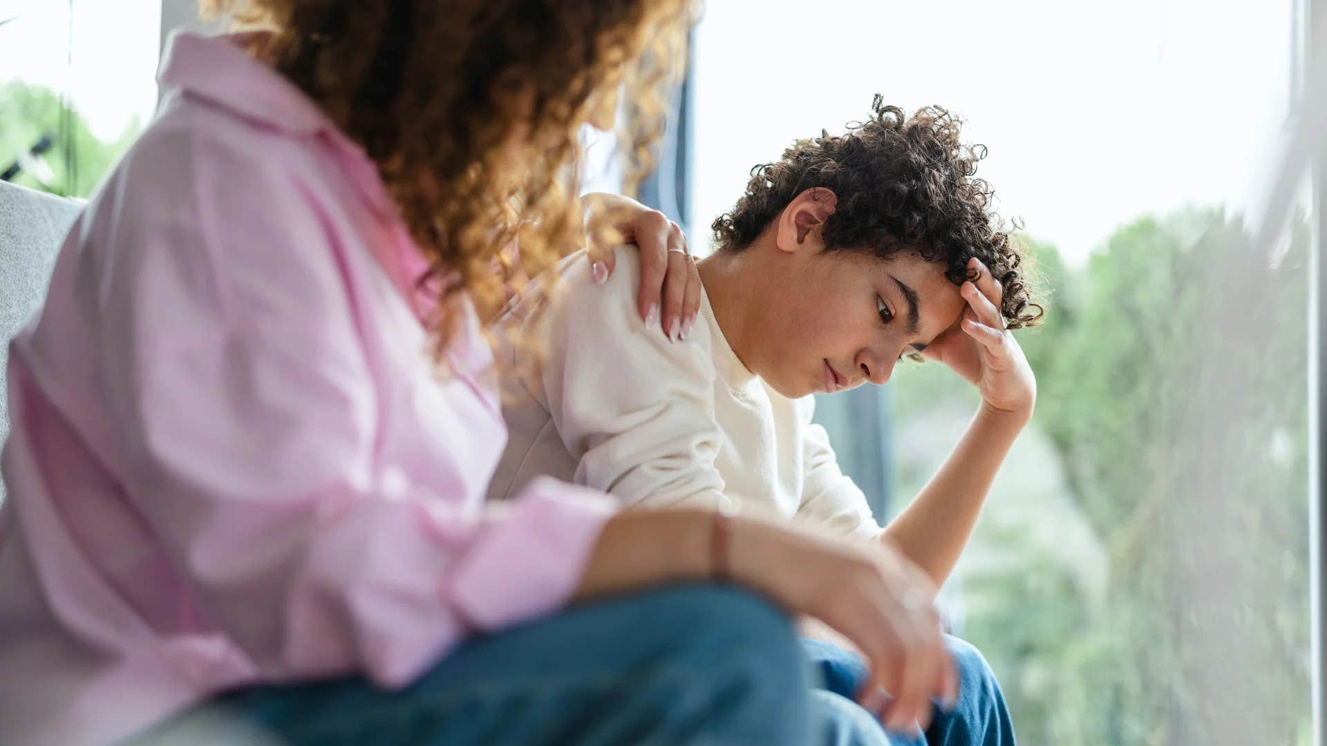 woman talking to teen son saying because i said so