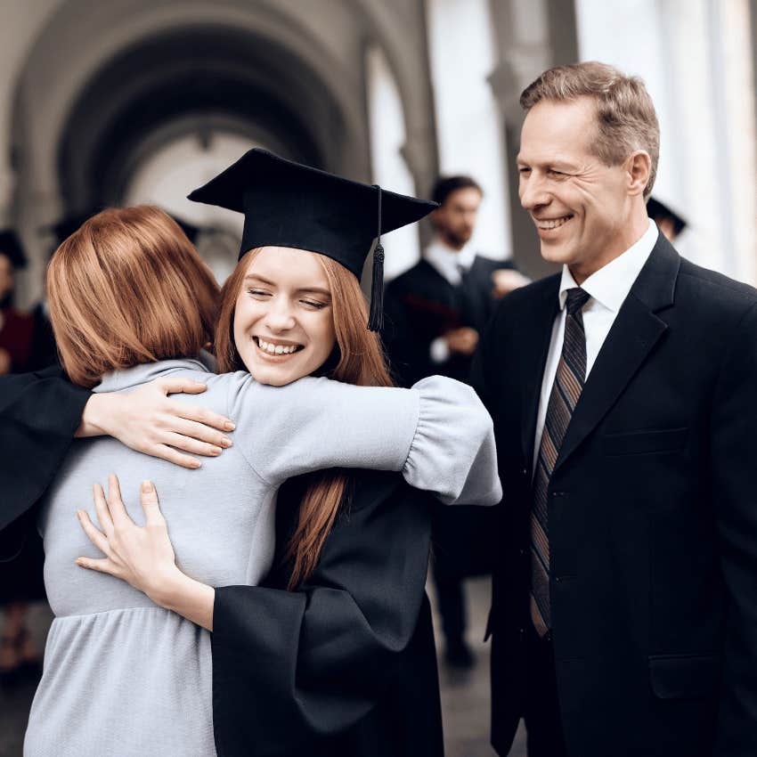 boomer parents hugging daughter after graduation only caring about her achievements