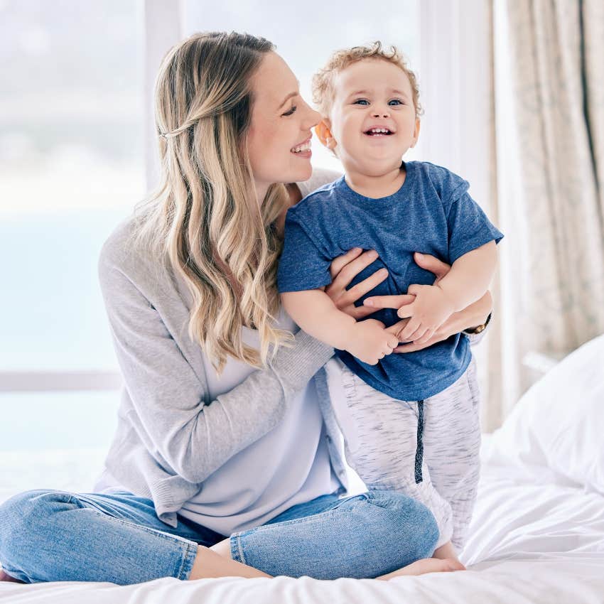mom holding son