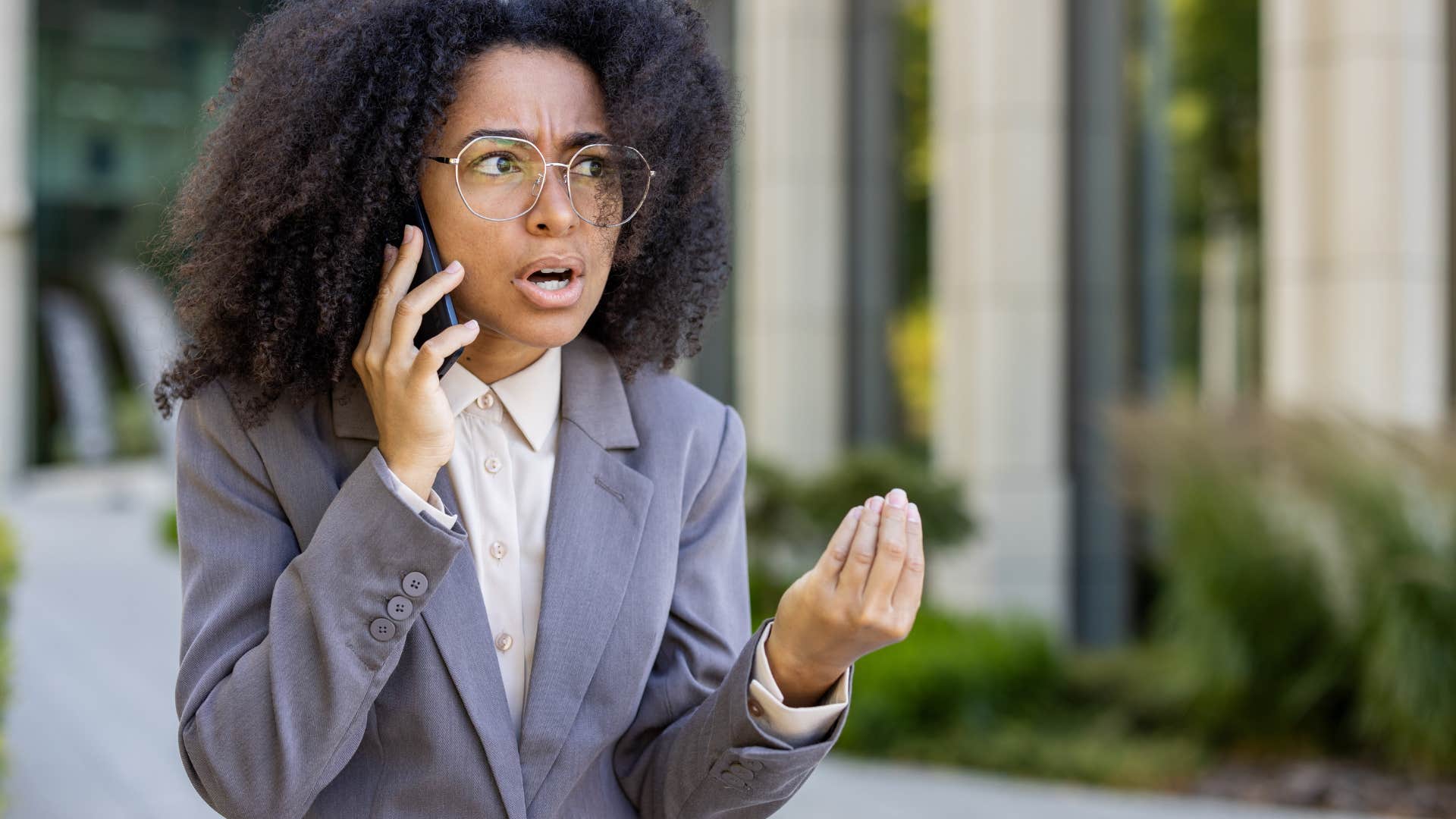 woman with exceptional self-control talking on the phone asking for a yes or no answer
