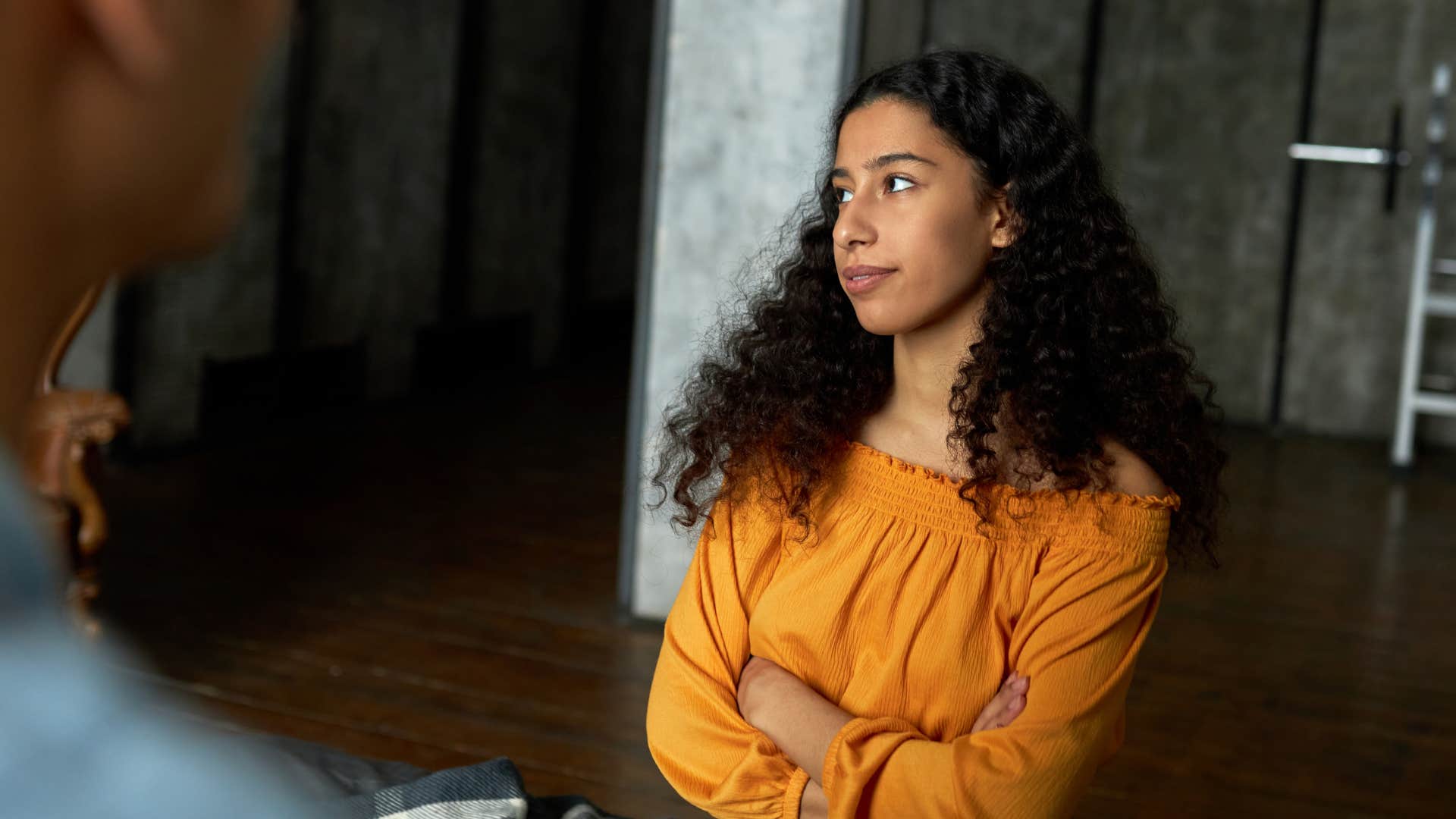 woman crossing her arms telling partner i don't have time for this