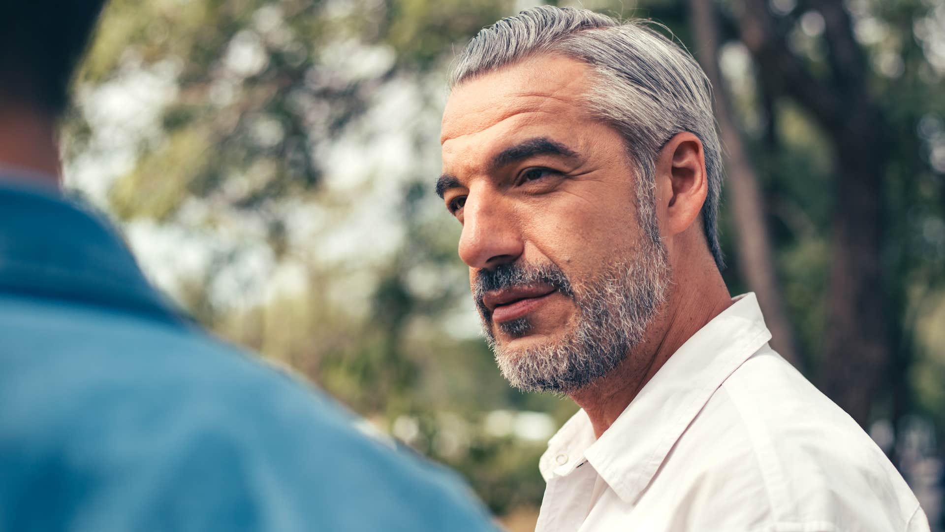 man with self-control in conversation telling friend now isn't a good time