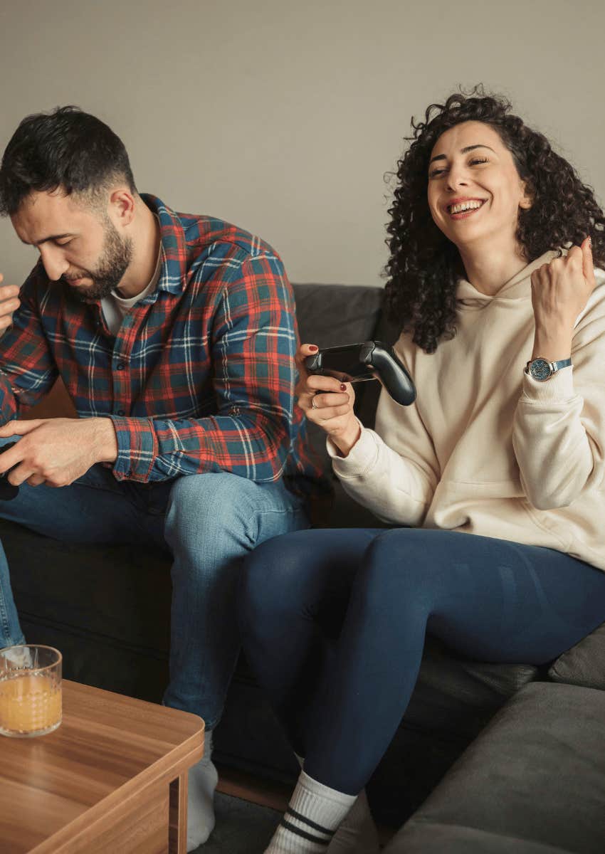 competitive couple playing video games