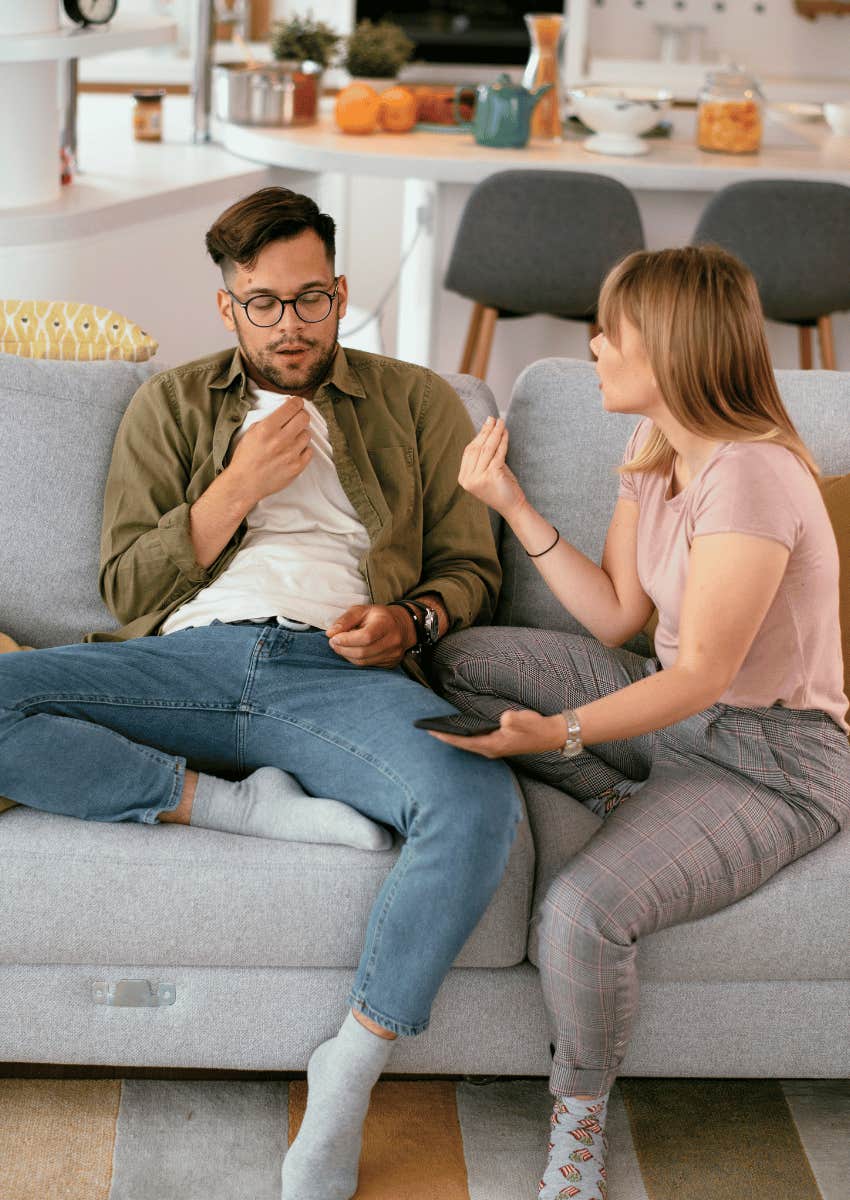 couple having a disagreement about tossed t-shirt
