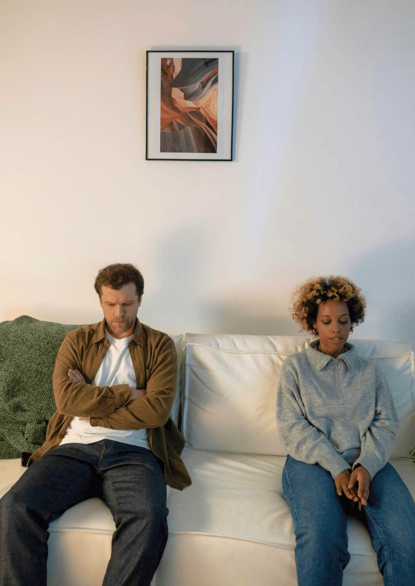 couple sitting on opposite side of a couch