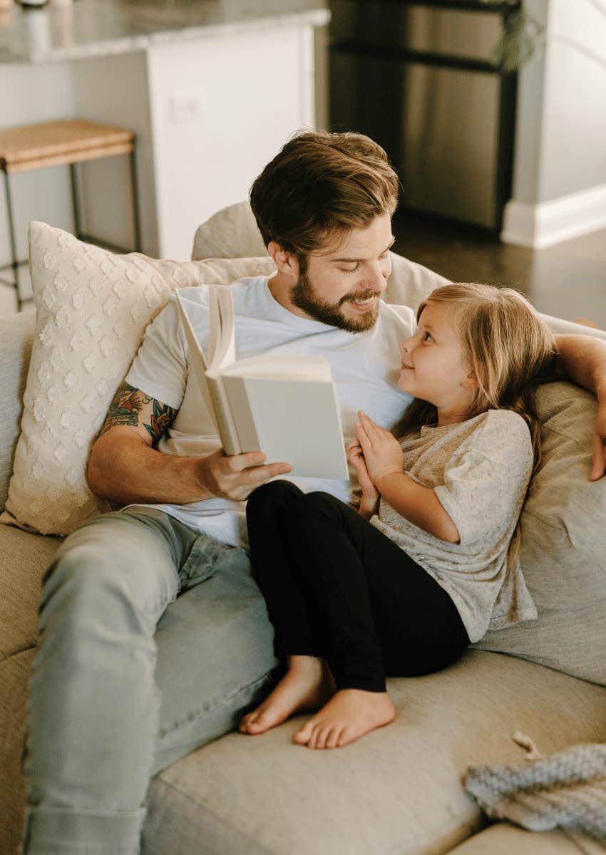 dad teaching his child to not on one gift