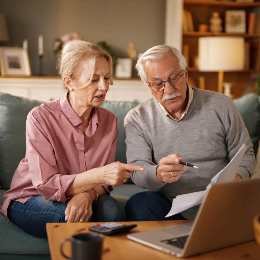 retired couple looking over savings after son asks them to pay for his daughters tuition
