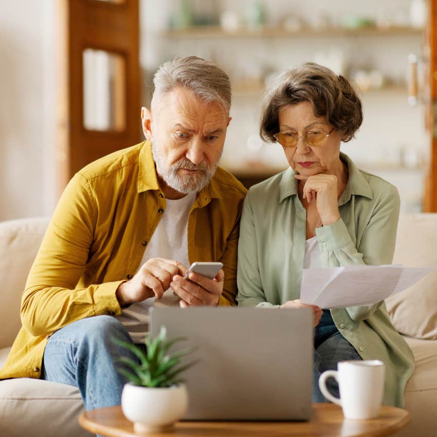 husband on his phone refusing to disrupt financial status quo in his marriage