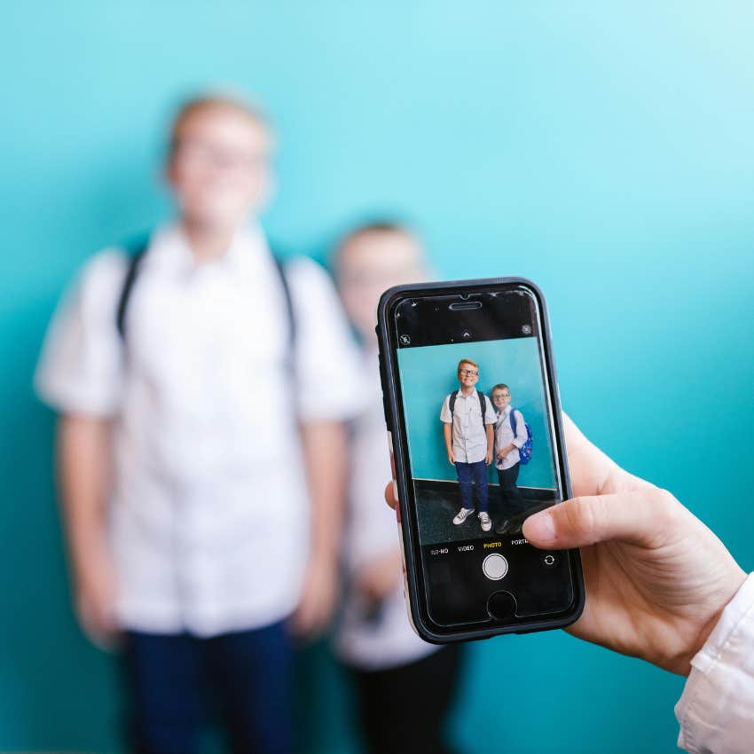 teacher taking a picture of students