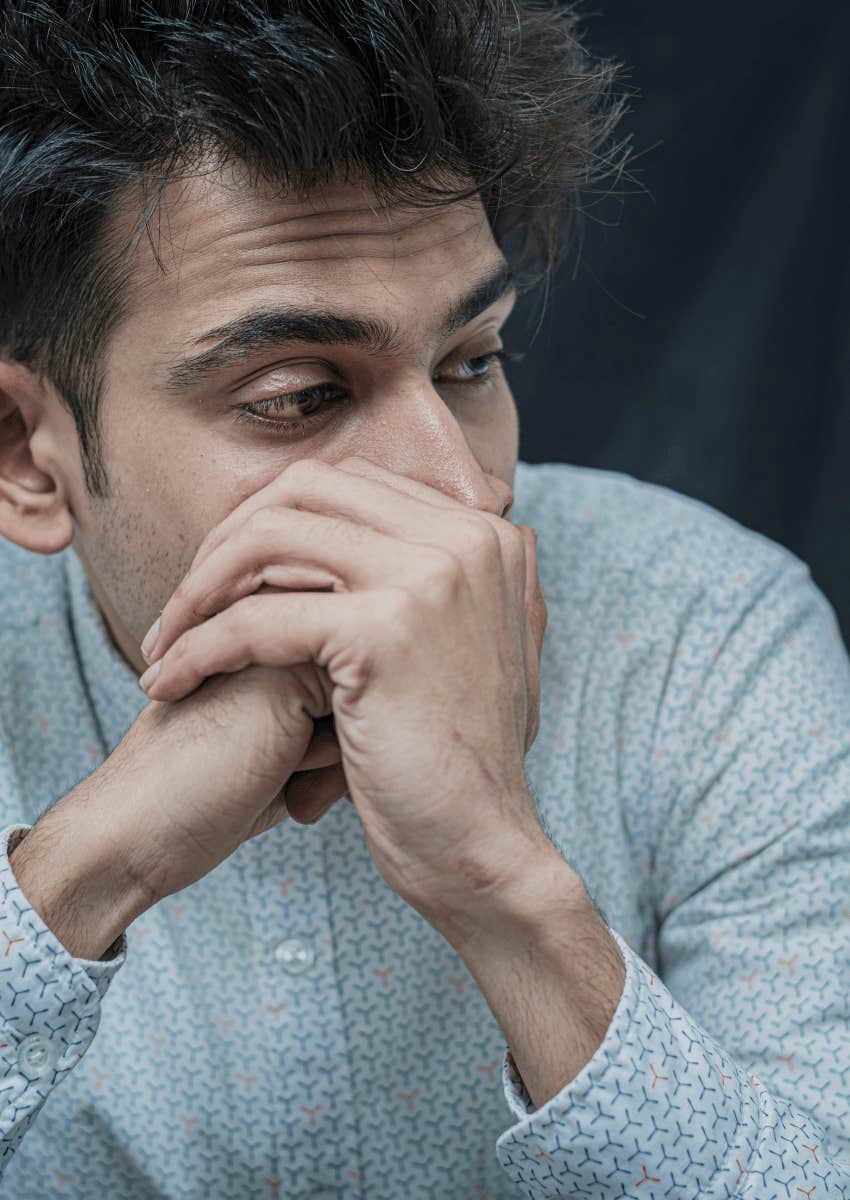embarrassed man looking away