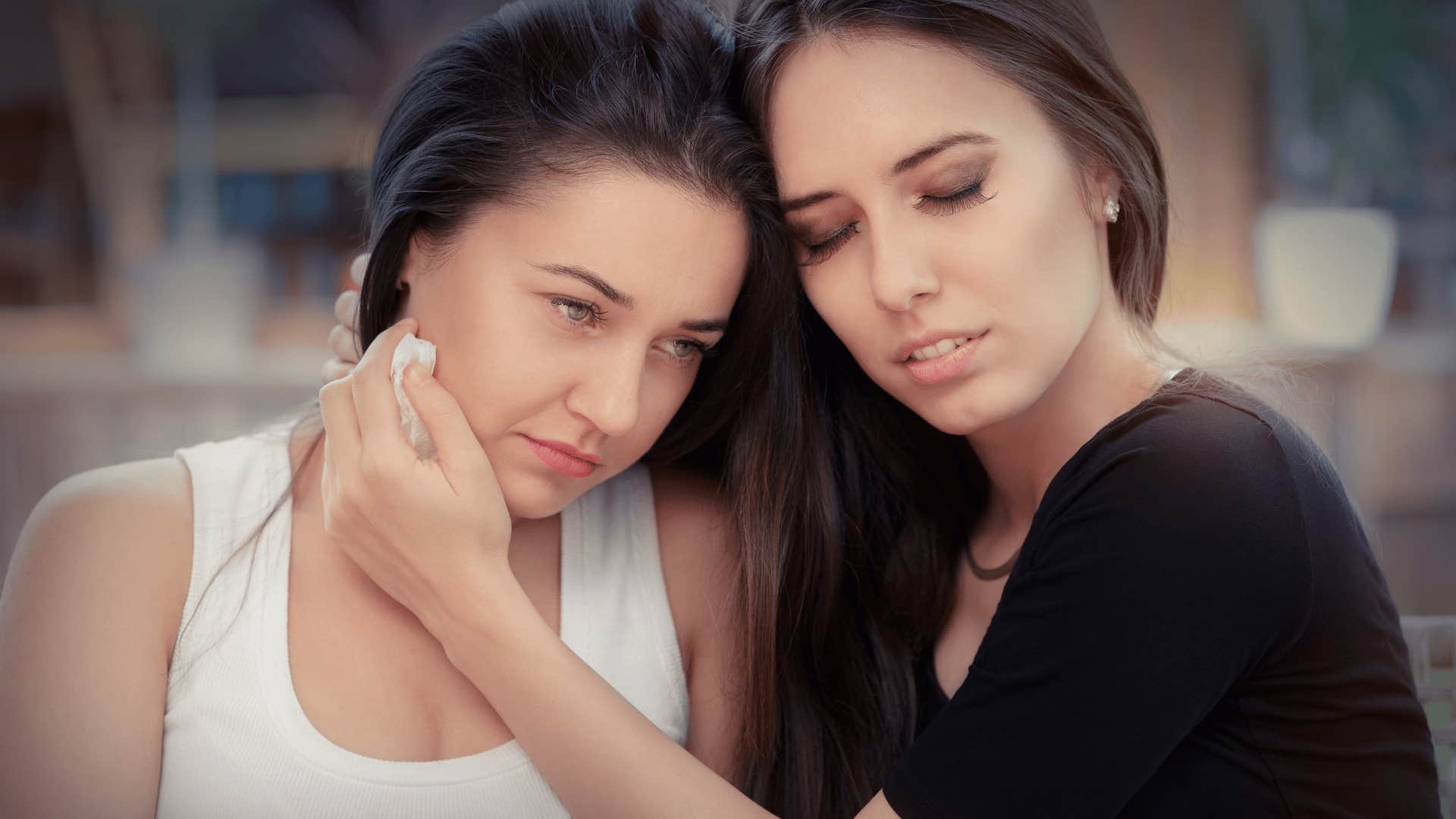 woman comforting emotionally draining friend who says i need you