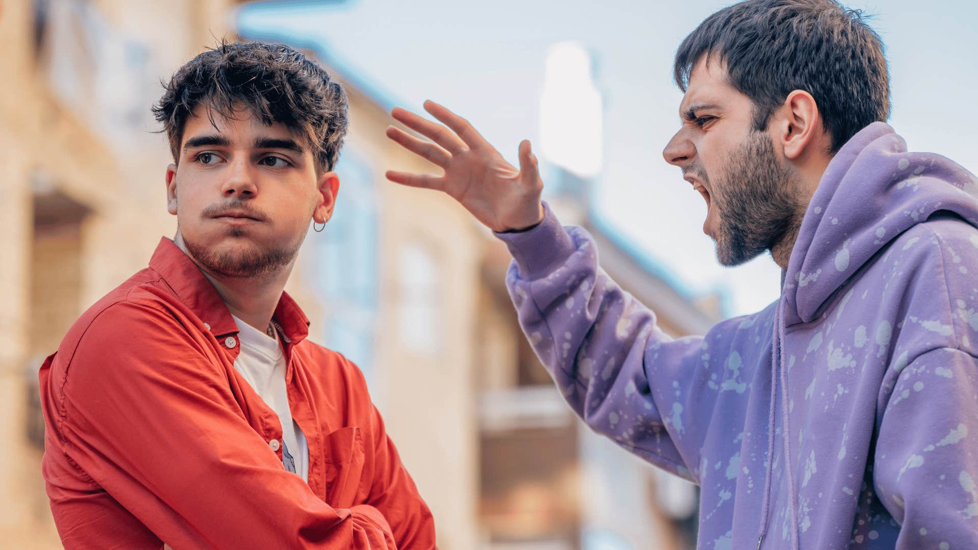angry man yelling at friend saying i told you so