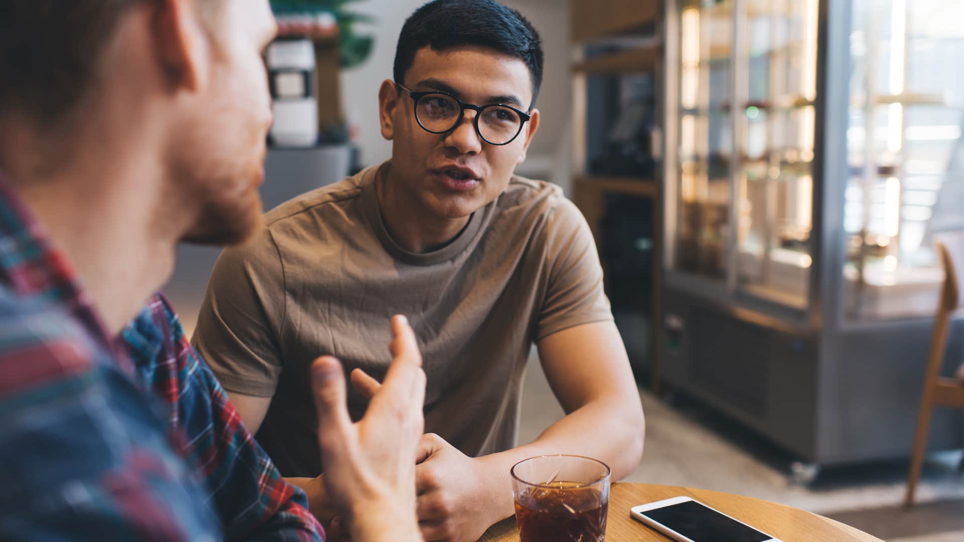 emotionally draining man wanting attention from friend at cafe
