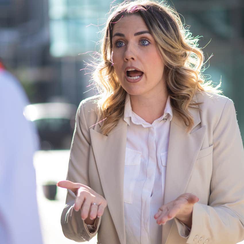 Woman feeding arguments for now reason outside.