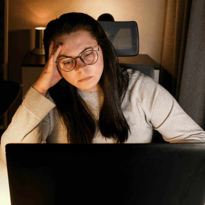 Woman with a pressure to stay busy all the time looking at her laptop.