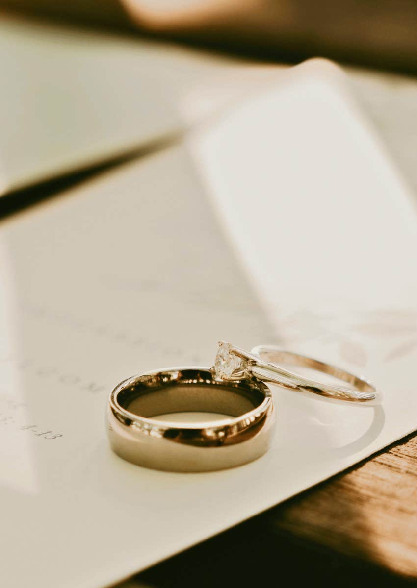 engagement ring and wedding band on table
