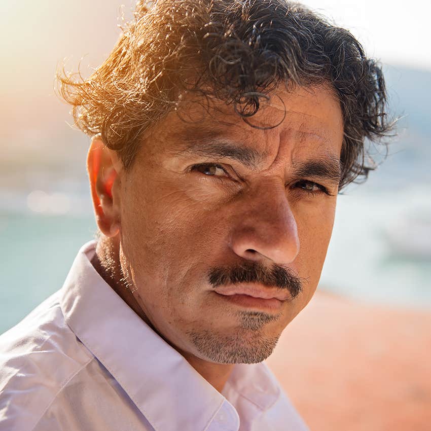 man with fleshy nose on beach
