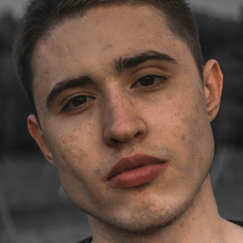 man with full lips making eye contact