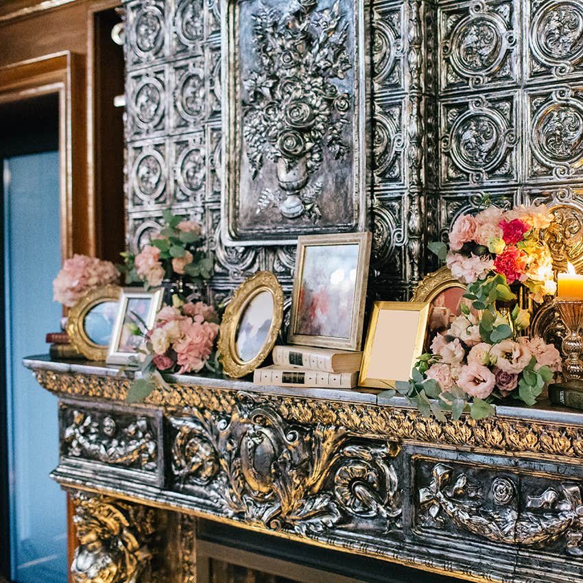 picture frames on top of a fireplace