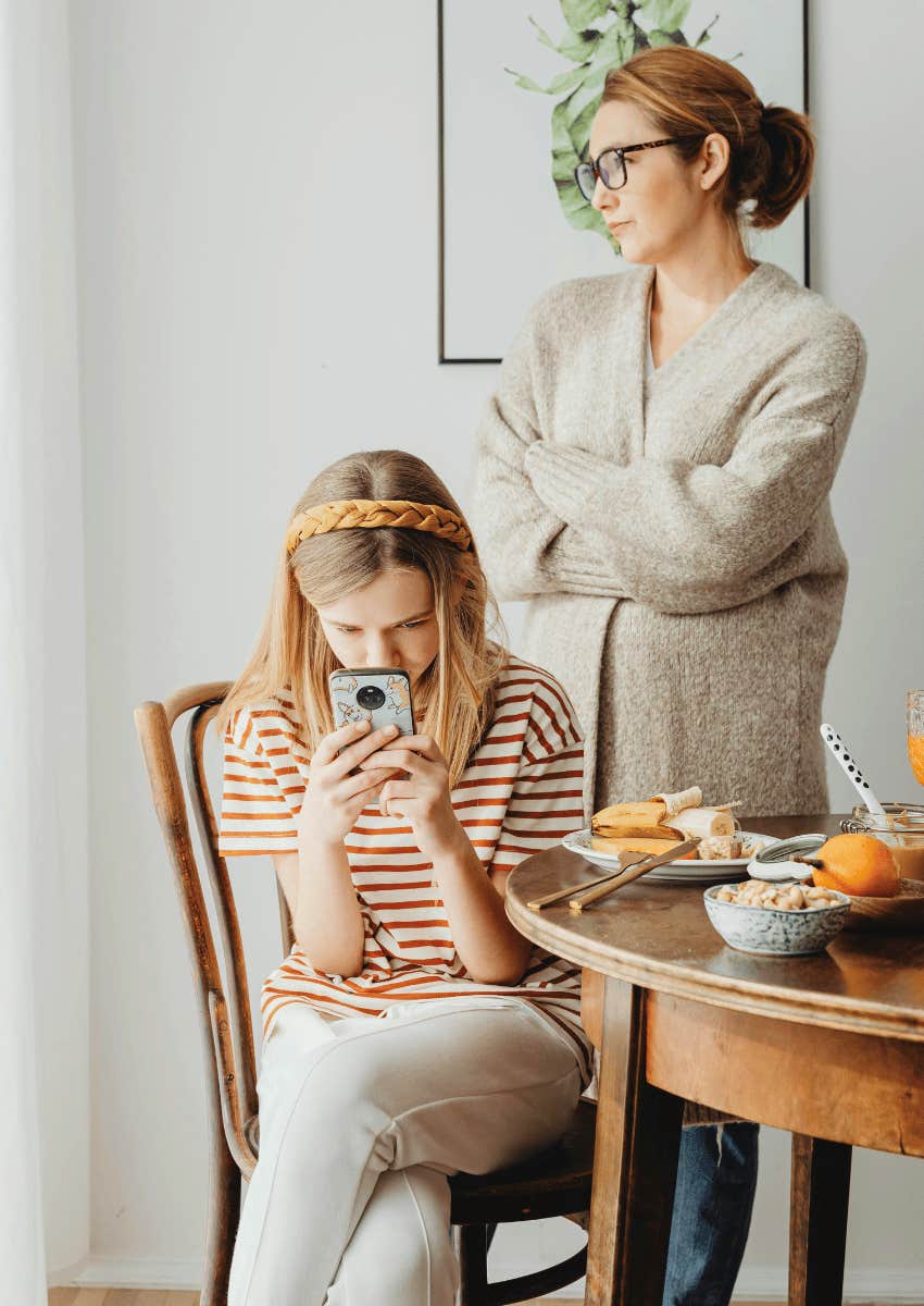 frustrated parent with an angry child ignoring them