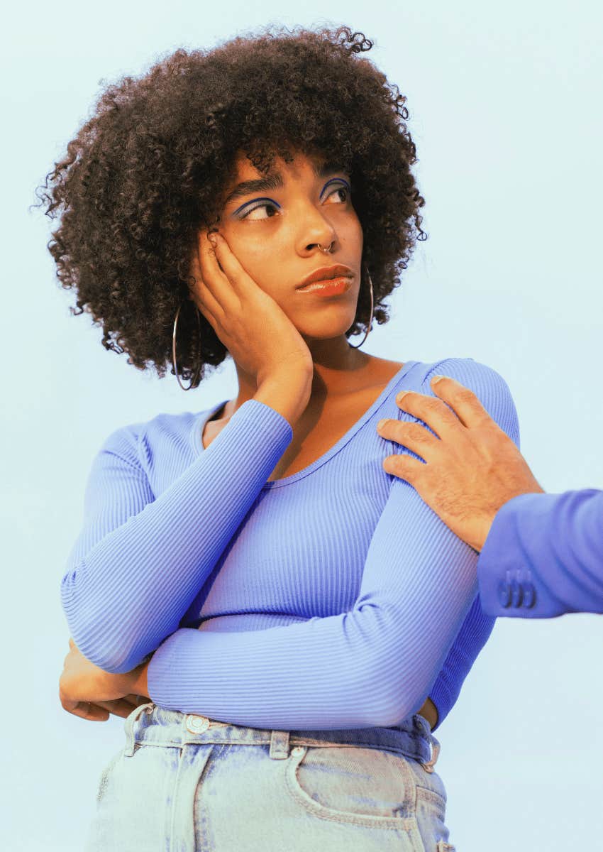 frustrated woman looking up at man