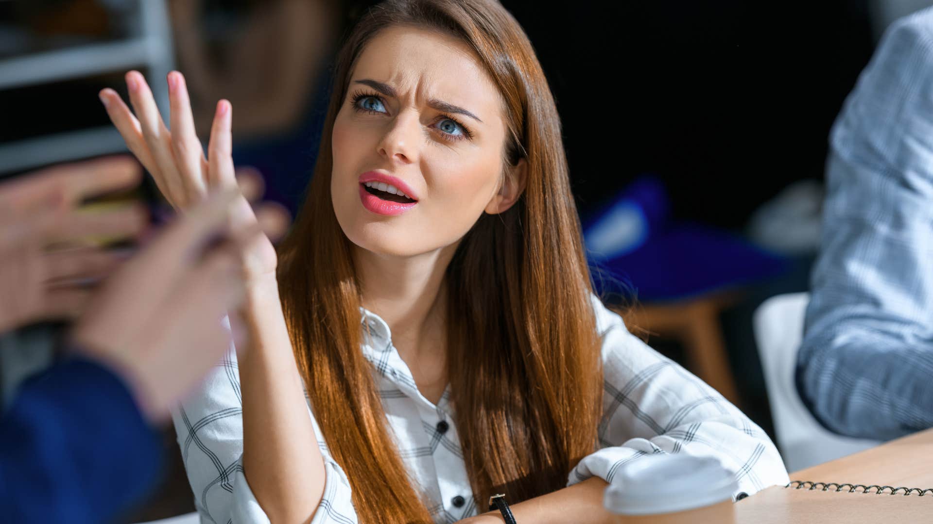 Young woman looking exasperated and acting argumentative 
