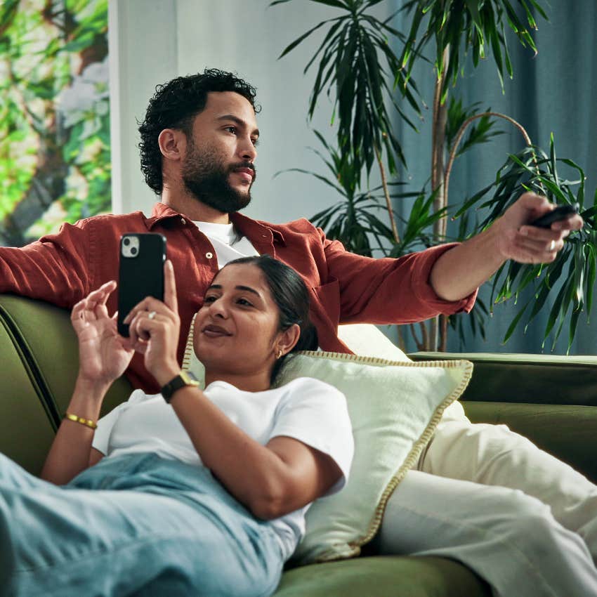woman who can't pay attention to a movie because she's on her phone