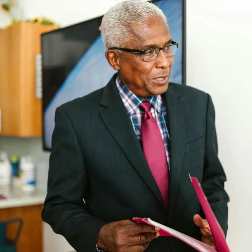boomer man wearing a suit and tie at work