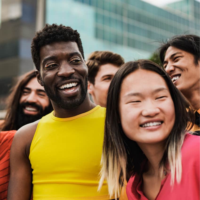 Genuinely confident young people looking up in a big city 