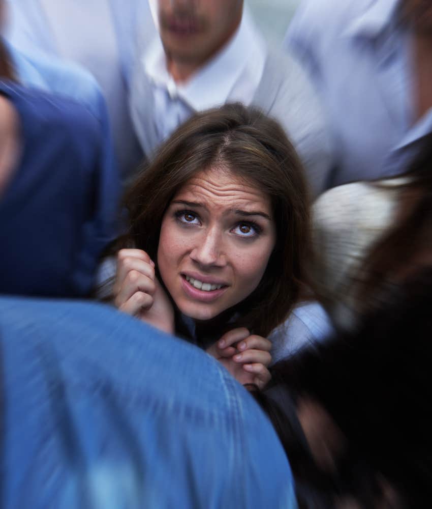 Scared person in crowd does not feel safe