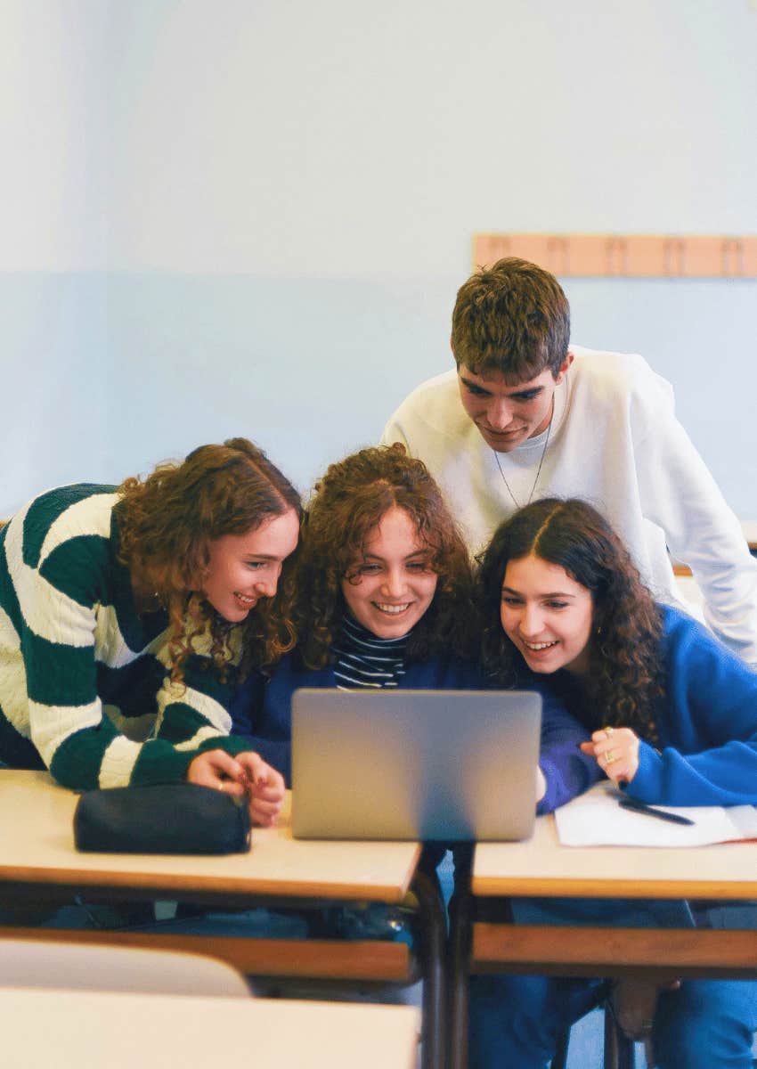 group of happy students working together