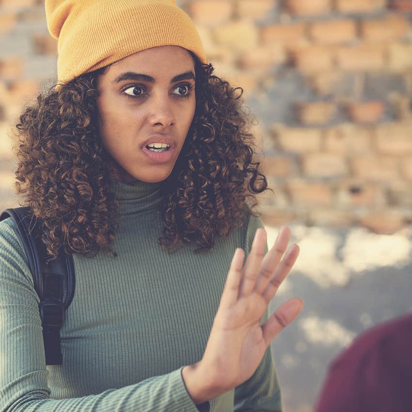 annoying woman interrupting friend to speak