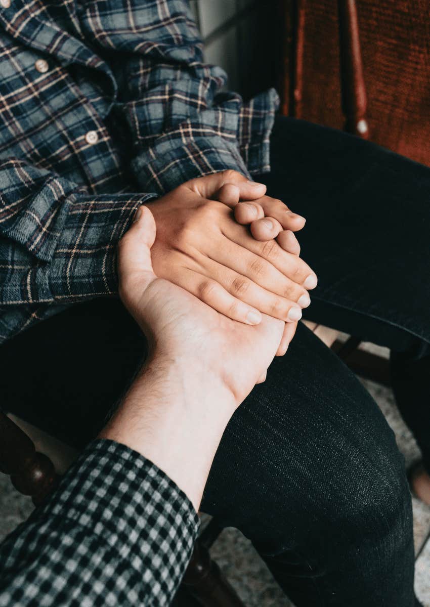 hands holding hand with empathy