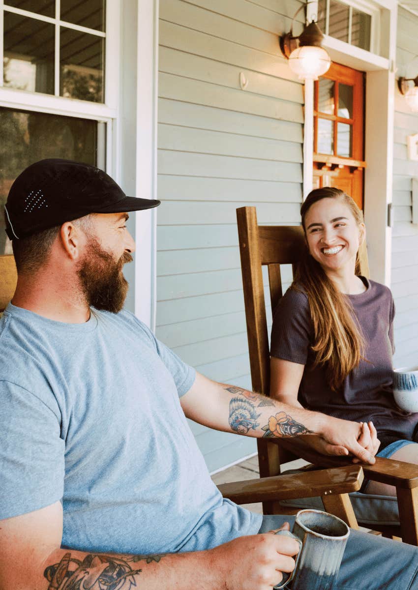 happy couple holding hand on porch