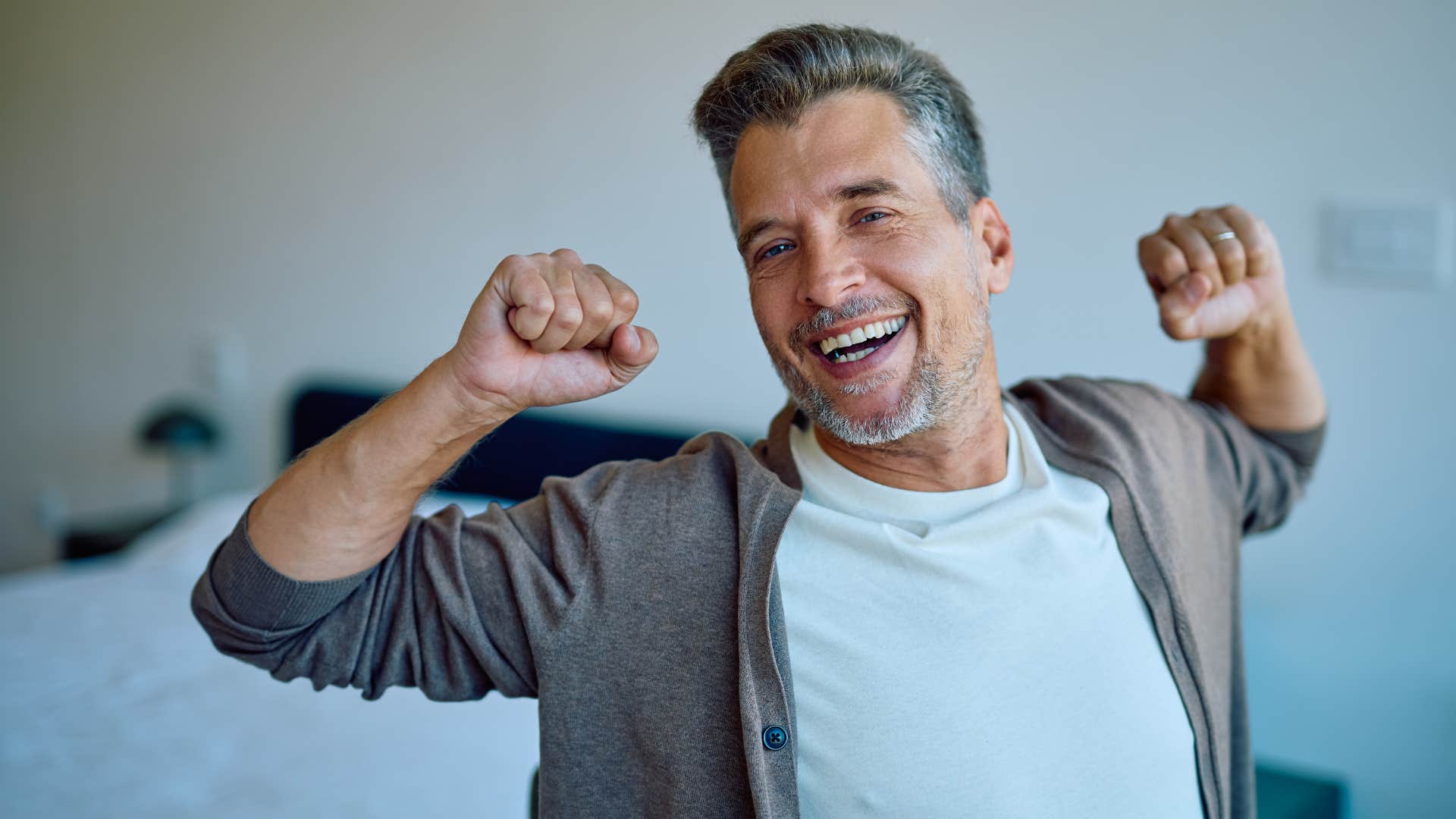 man stretching feeling well-rested and not burnt out