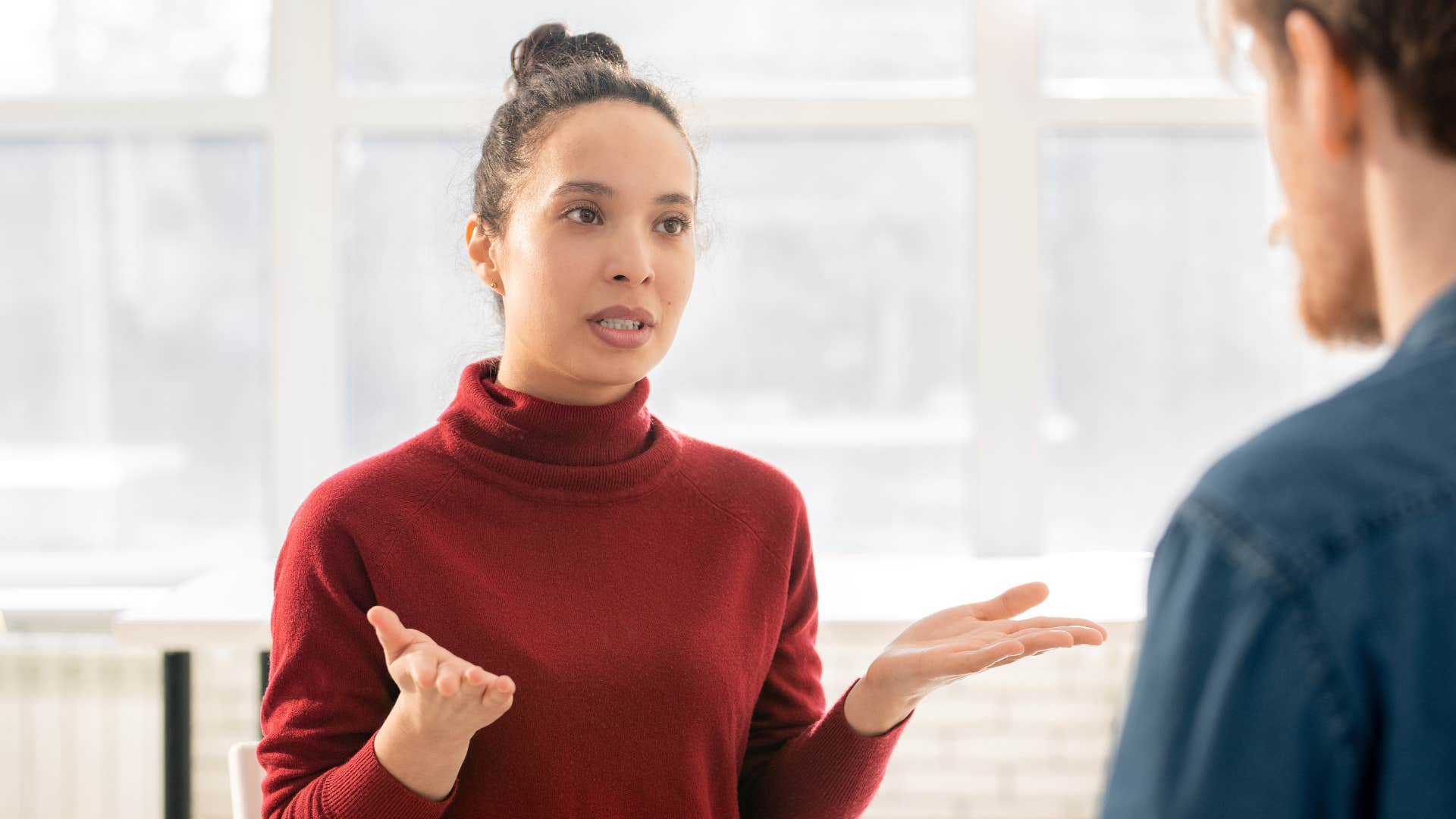 woman over-explaining her habits to colleague