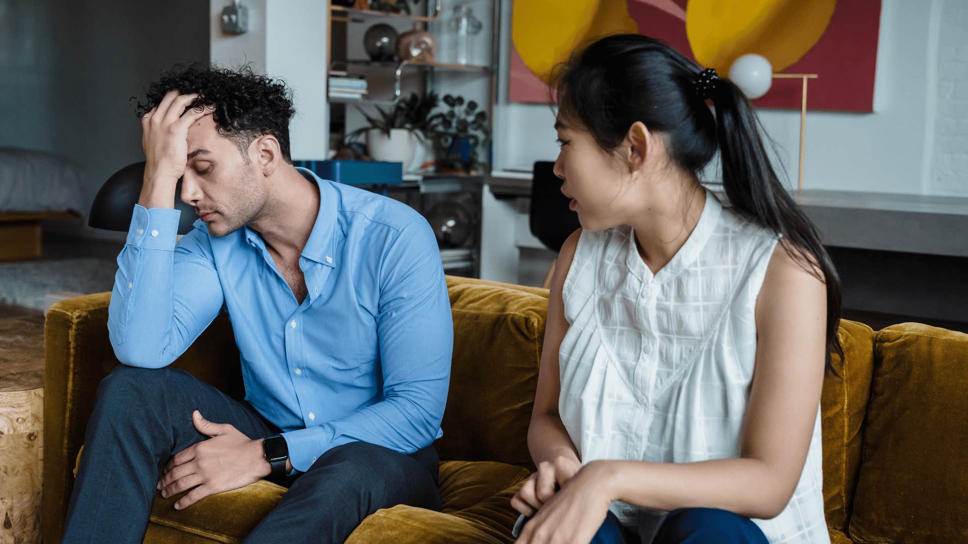 man playing the victim with his girlfriend