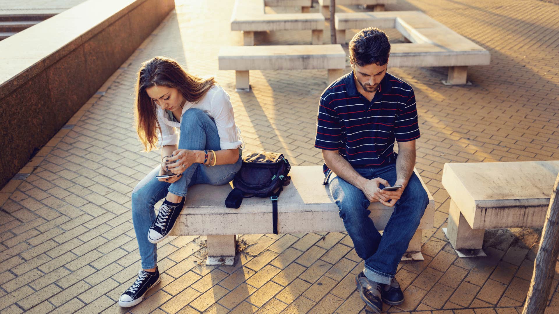 man ignoring his girlfriend