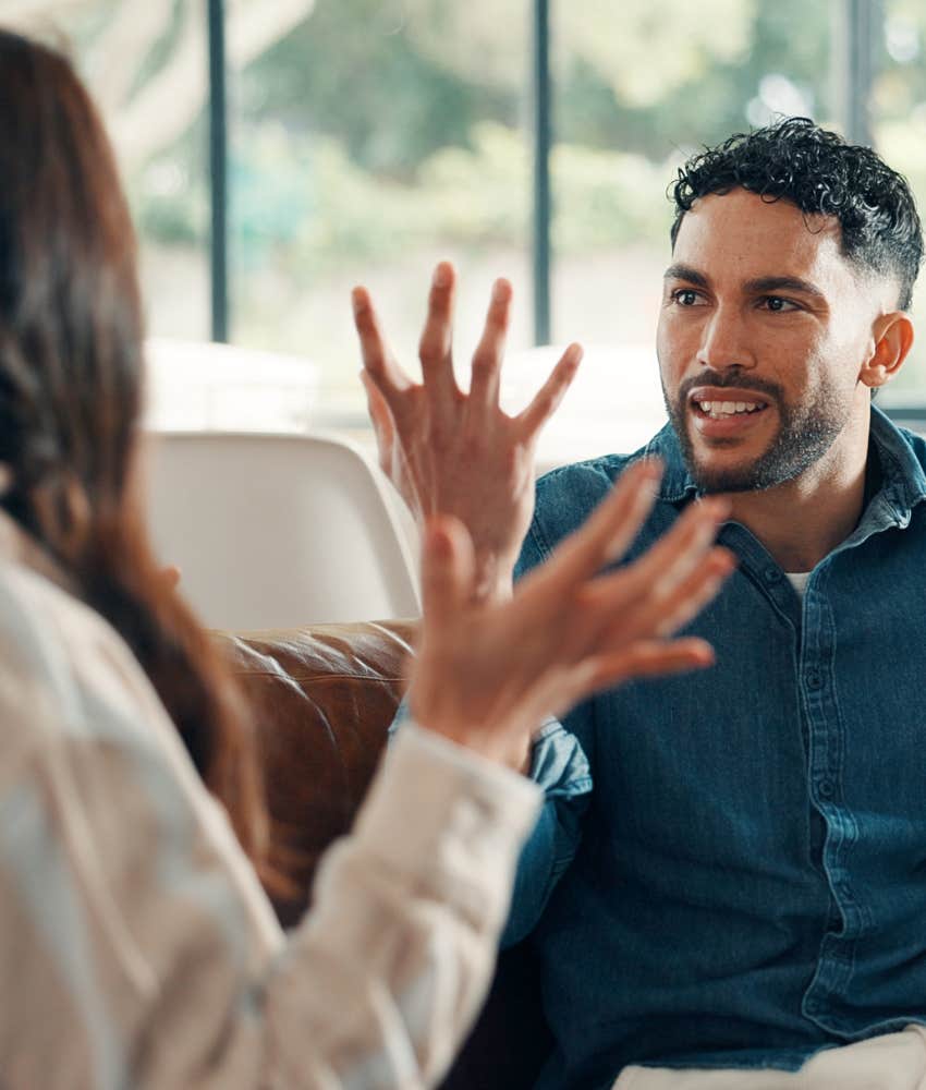 upset husband gestures to avoid conversation with wife