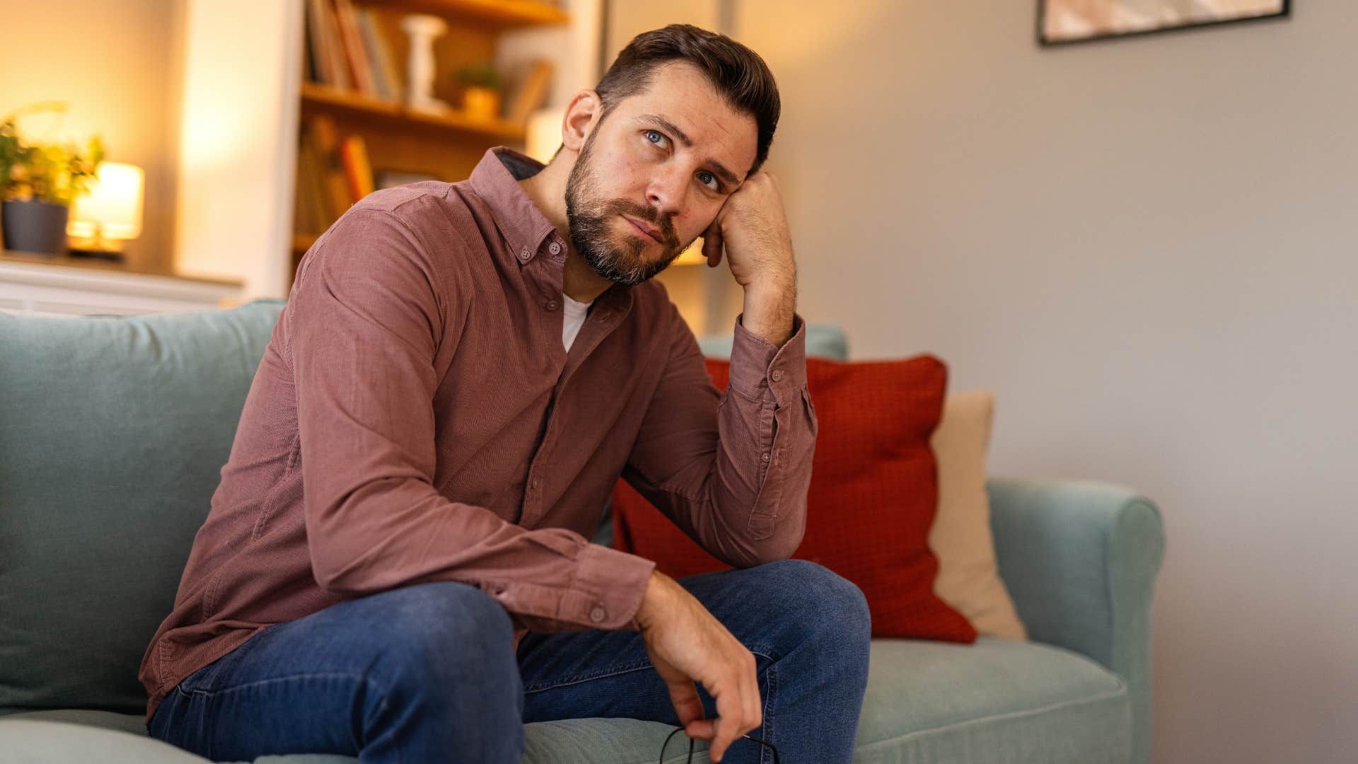 man sitting by himself at home in silence