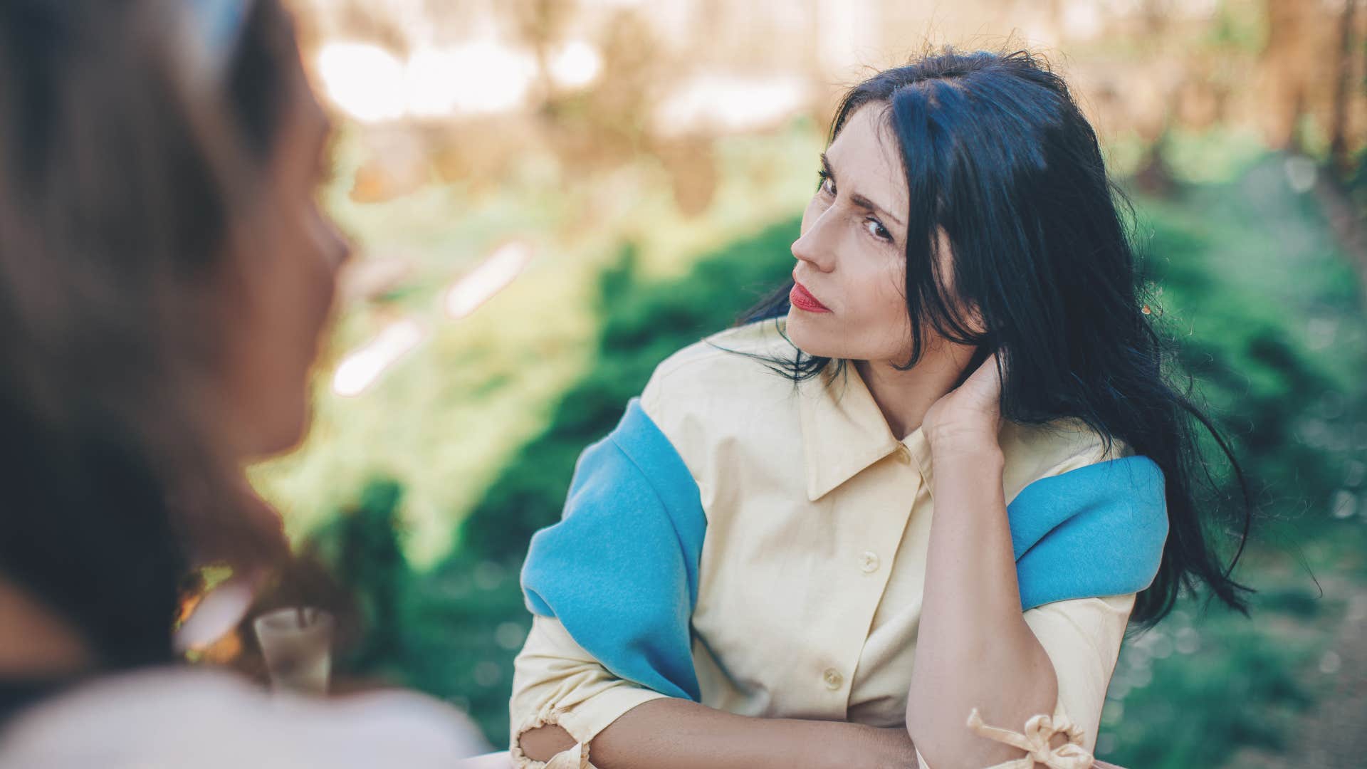 high-iq woman perplexed noticing inconsistencies in conversation with friend