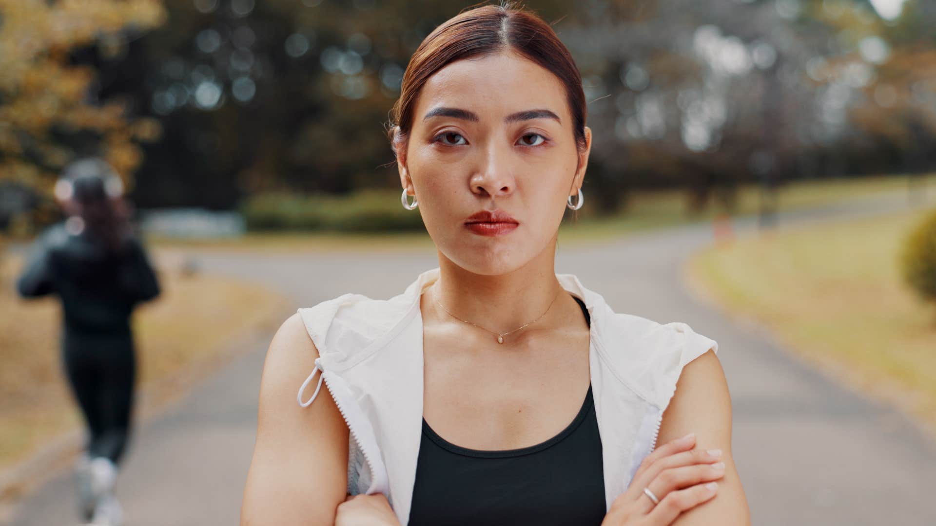 high iq woman with arms crossed preferring clarity over emotion
