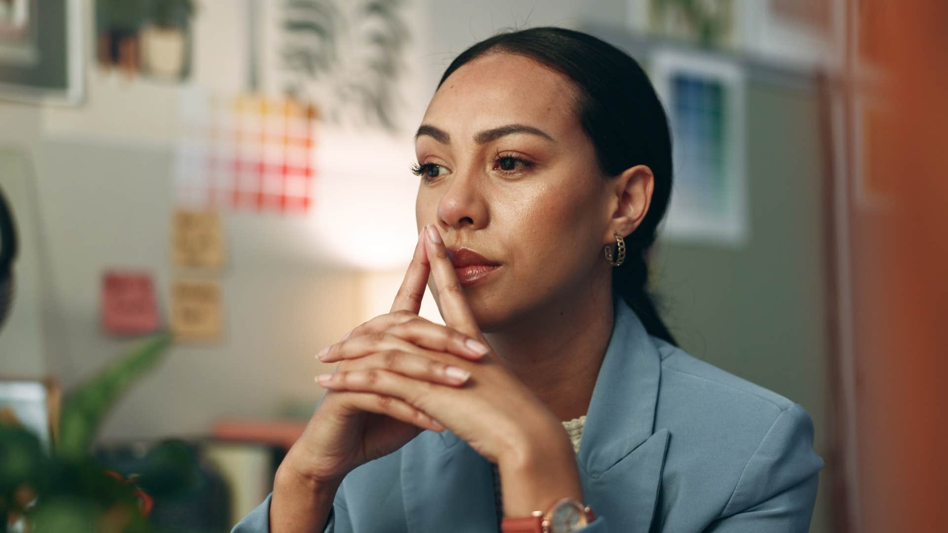 high iq woman with a strong internal dialogue sitting in deep thought