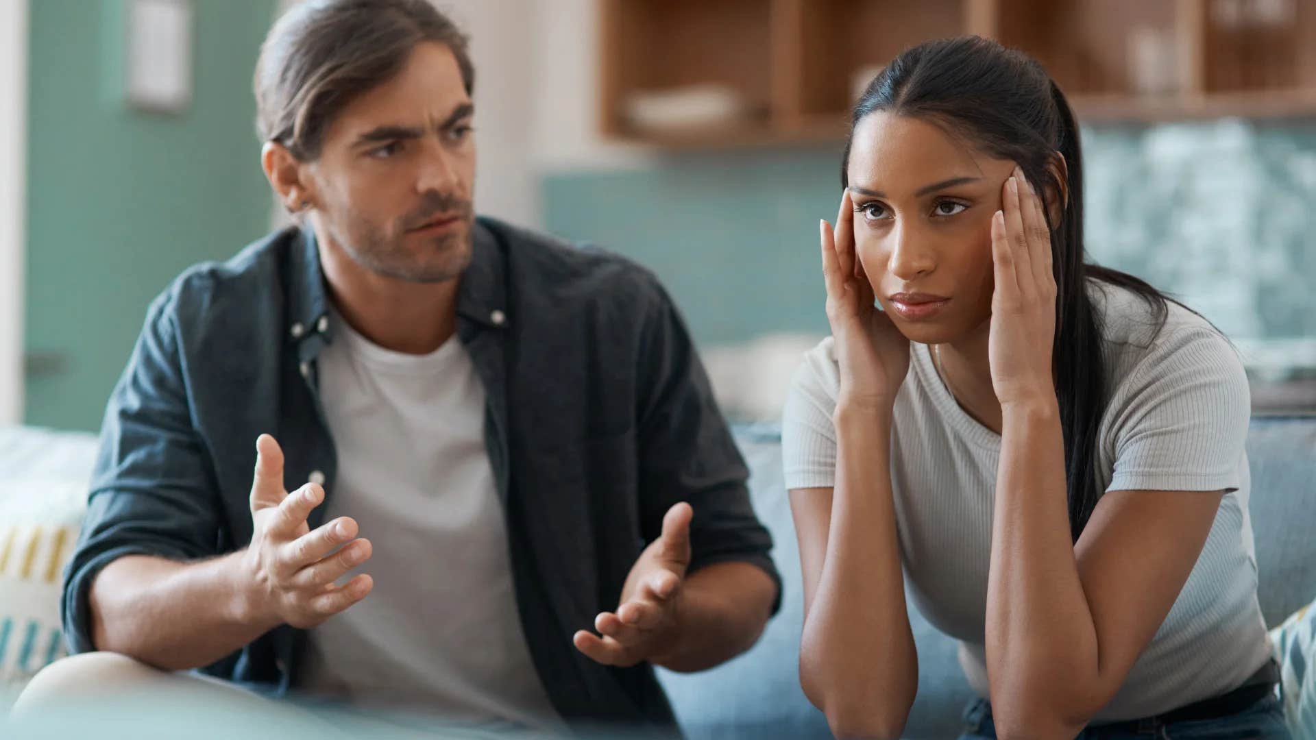 upset woman feeling unheard by husband talking to her