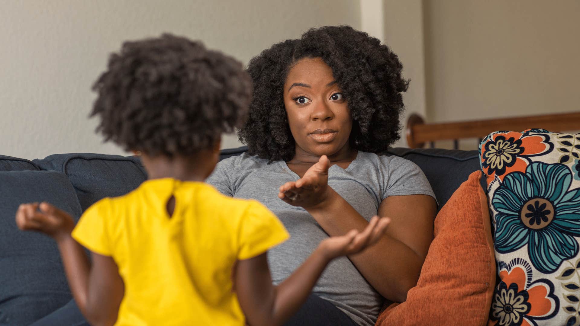 daughter learning to repeat patterns her mother showed