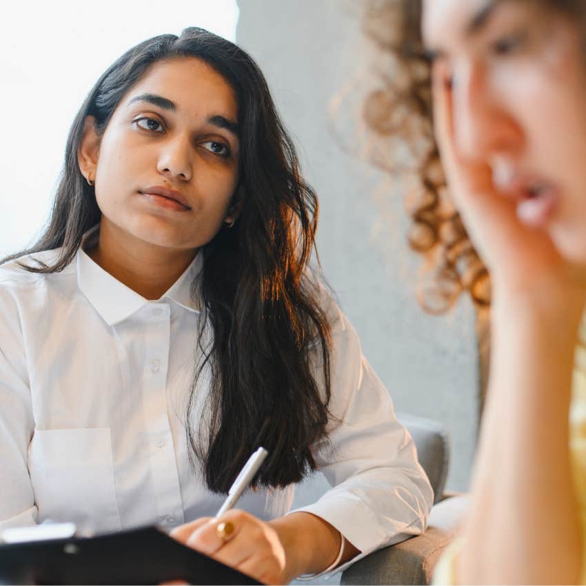 woman with a deep personality unable to ignore social energy looking at colleague