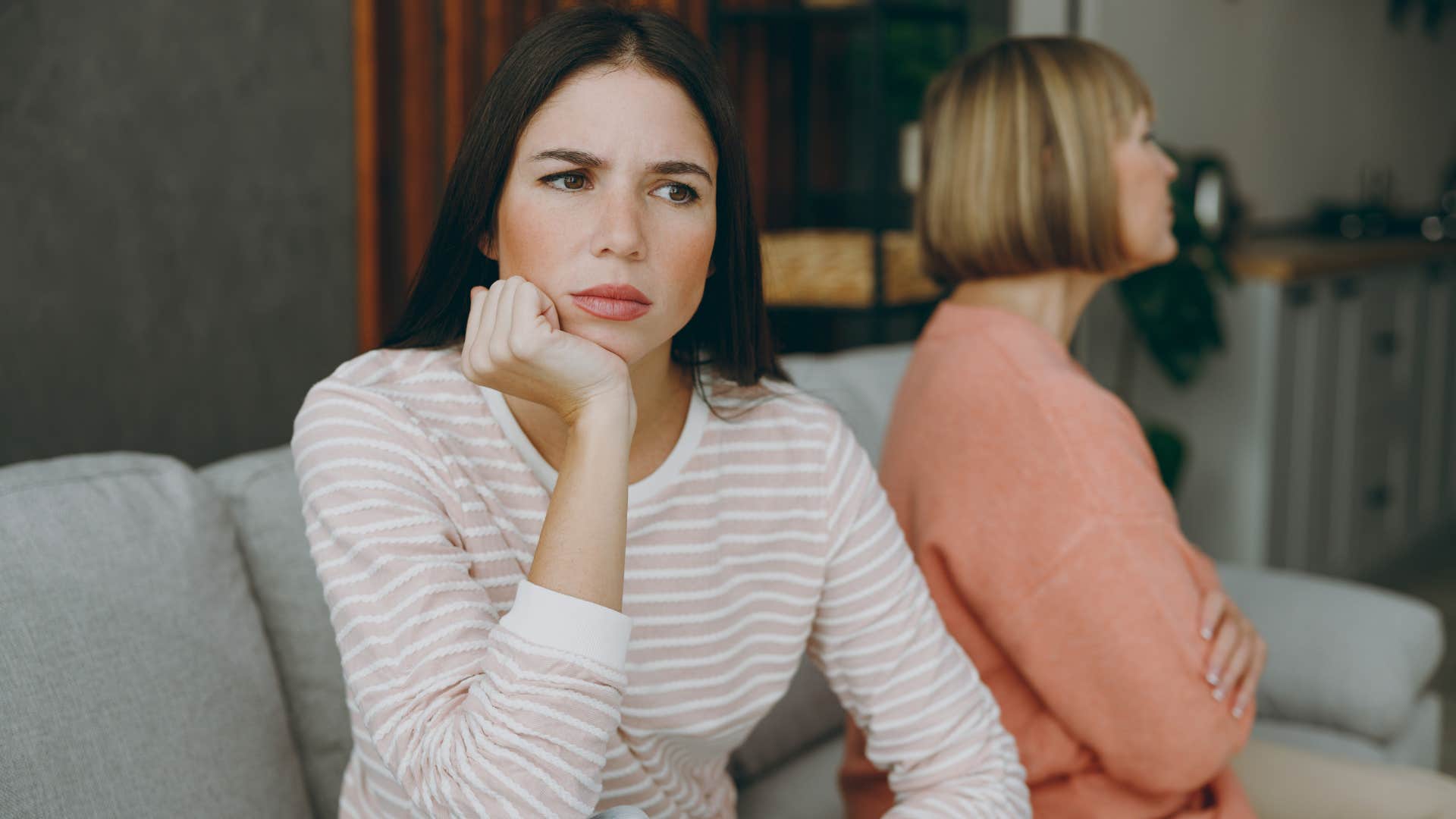 woman feeling resentful toward her mother thinking she loves her pets more than her